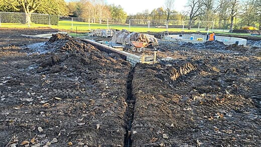 Trench goes to a retaining wall