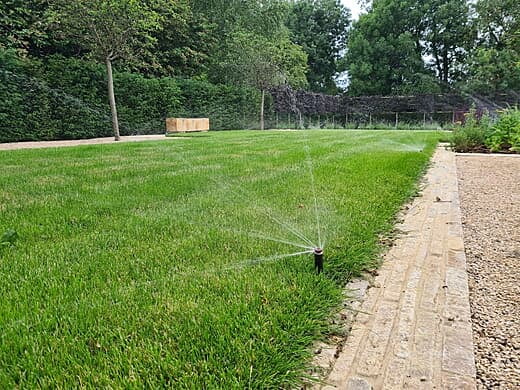 Running lawn irrigation in the formal garden