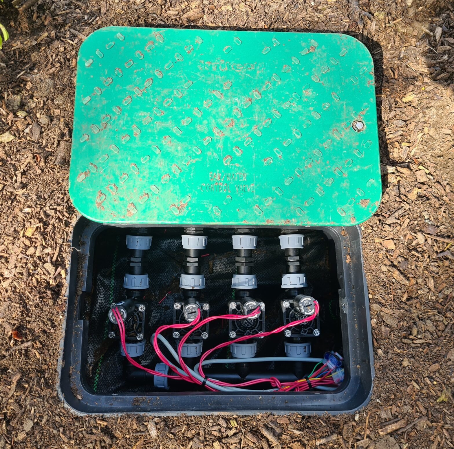 distribution unit in valve box with solenoids as beginning of the zones